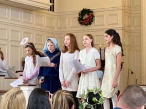 children singing in a church choir