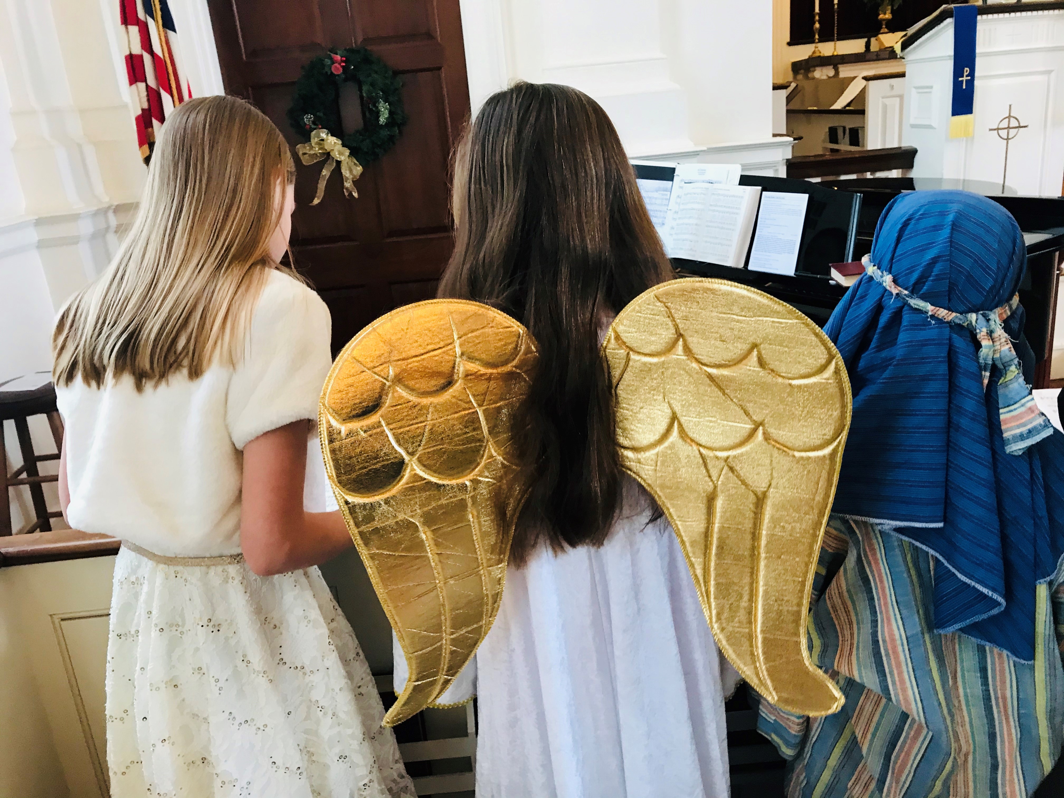 children of the choir dressed as angels and a shepard